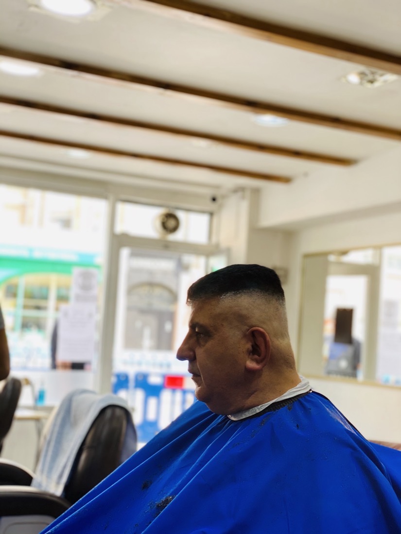 A clean high fade finished at Cutt Throat barbershop